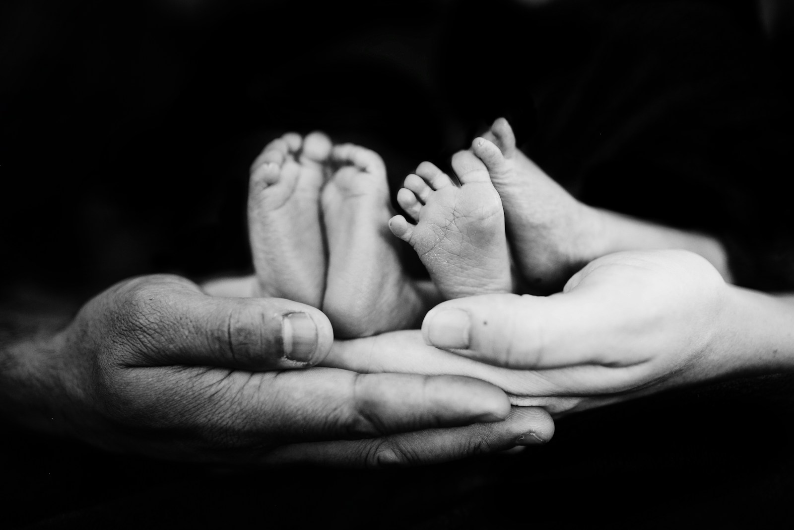 babys hand on human palm